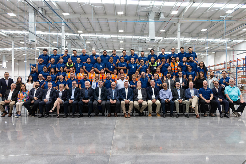 group shot of employees on factory floor