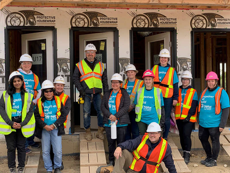 team members at house building project