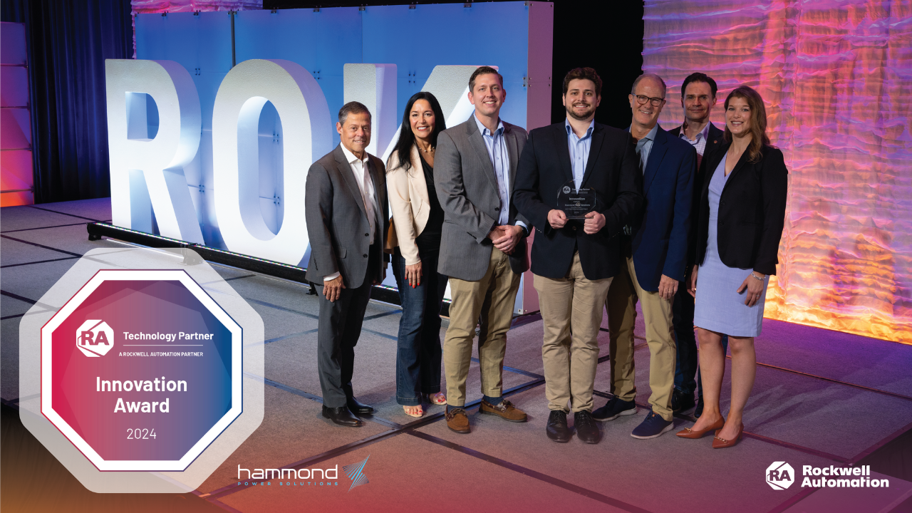 smiling hps team accepts rockwell automation innovation award